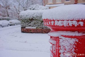 Red British Royal Mail Postbox in Winter